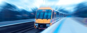 Commuter train gliding into a station